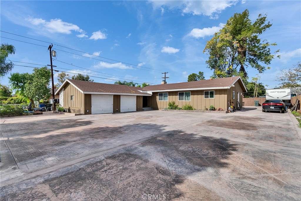5121 Sierra Street Riverside, CA 92504 - Photo 10 of 34 a front view of a house with a yard and garage