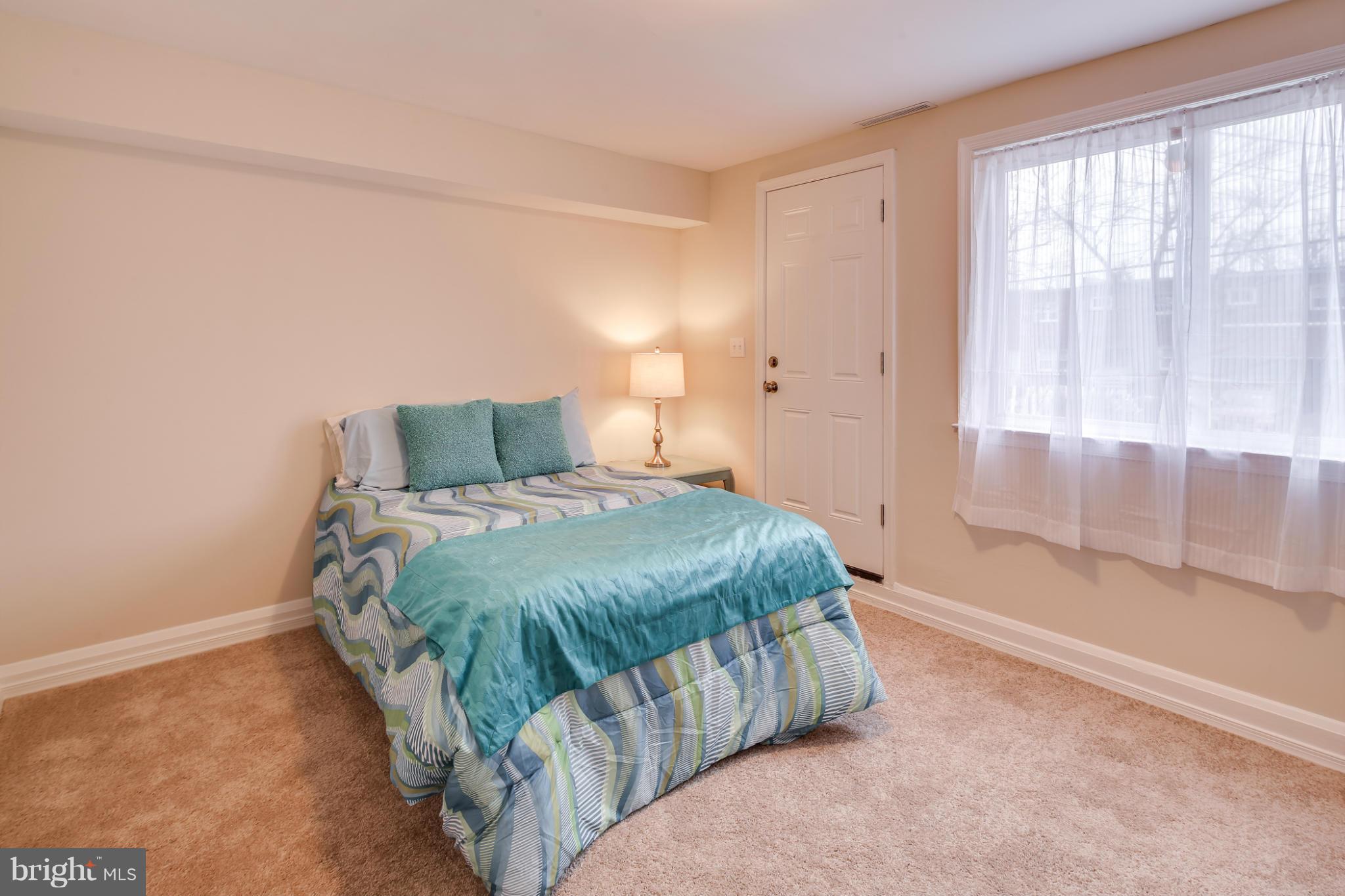 1315 Deanwood Road Baltimore, MD 21234 - Photo 13 of 30 a bedroom with a bed and window