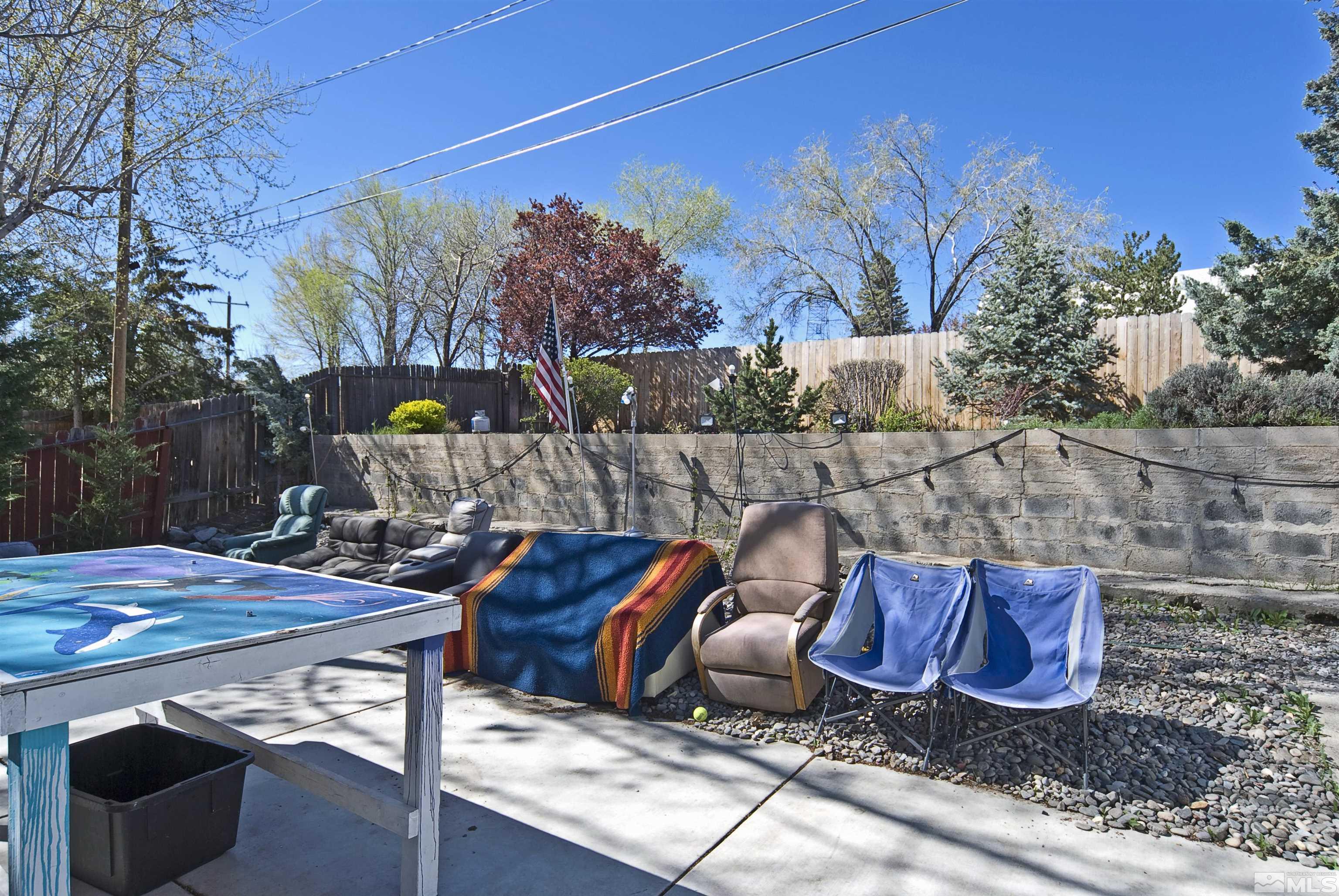 121 Bartlett Street Reno, NV 89512 - Photo 17 of 27 a view of a backyard with sitting area