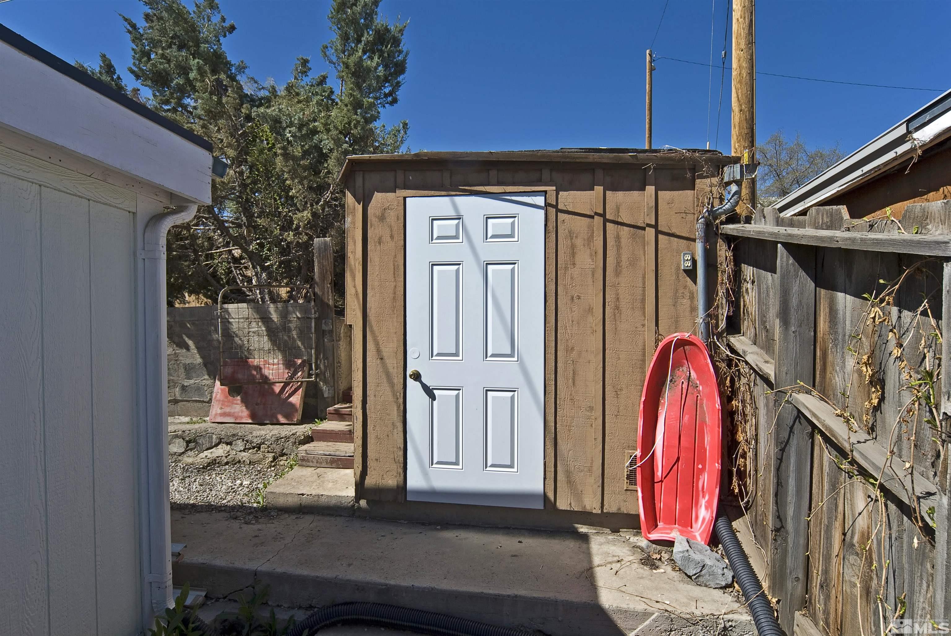 121 Bartlett Street Reno, NV 89512 - Photo 19 of 27 a view of a house with wooden floor and a potted plant