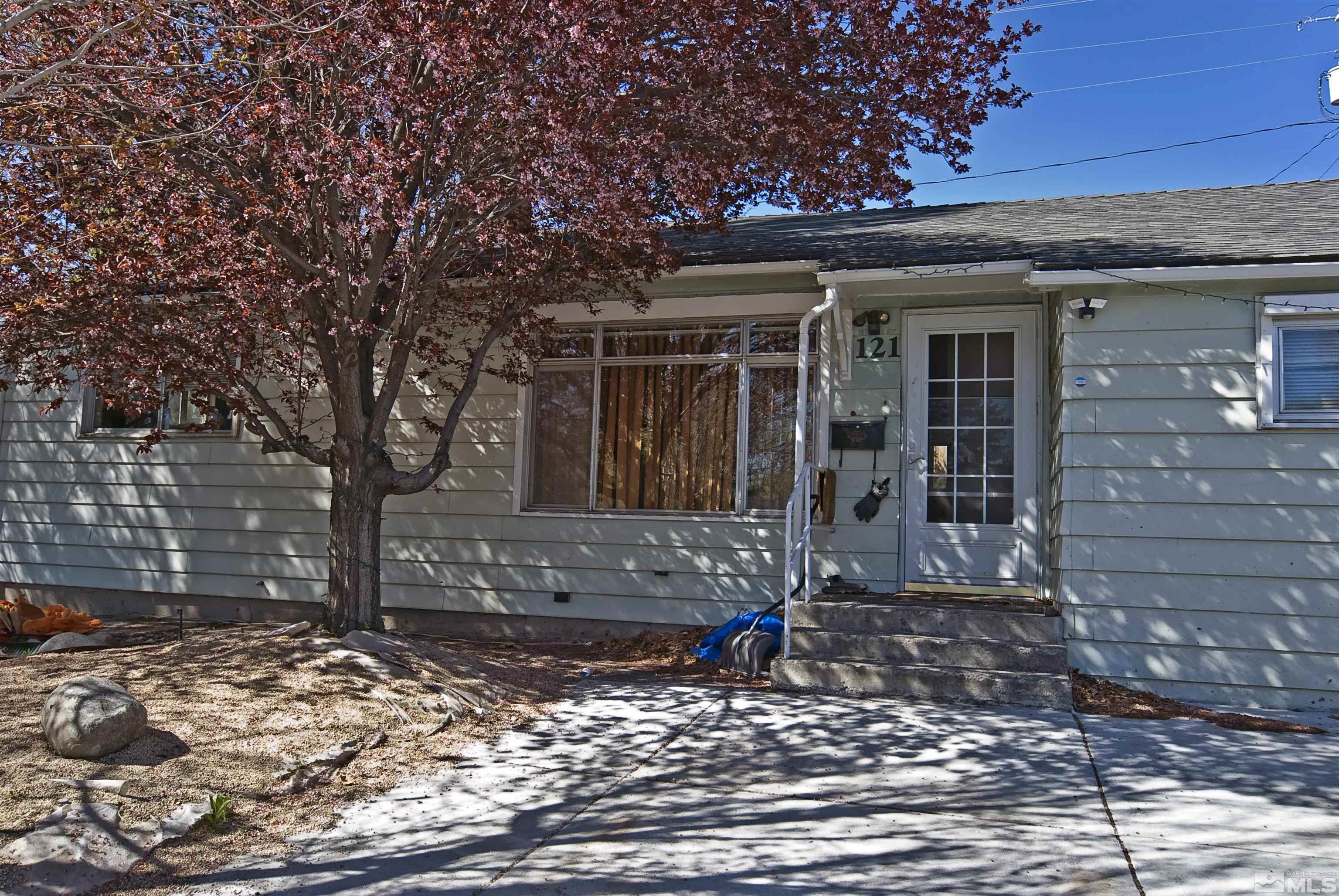 121 Bartlett Street Reno, NV 89512 - Photo 2 of 27 a front view of a house with garden