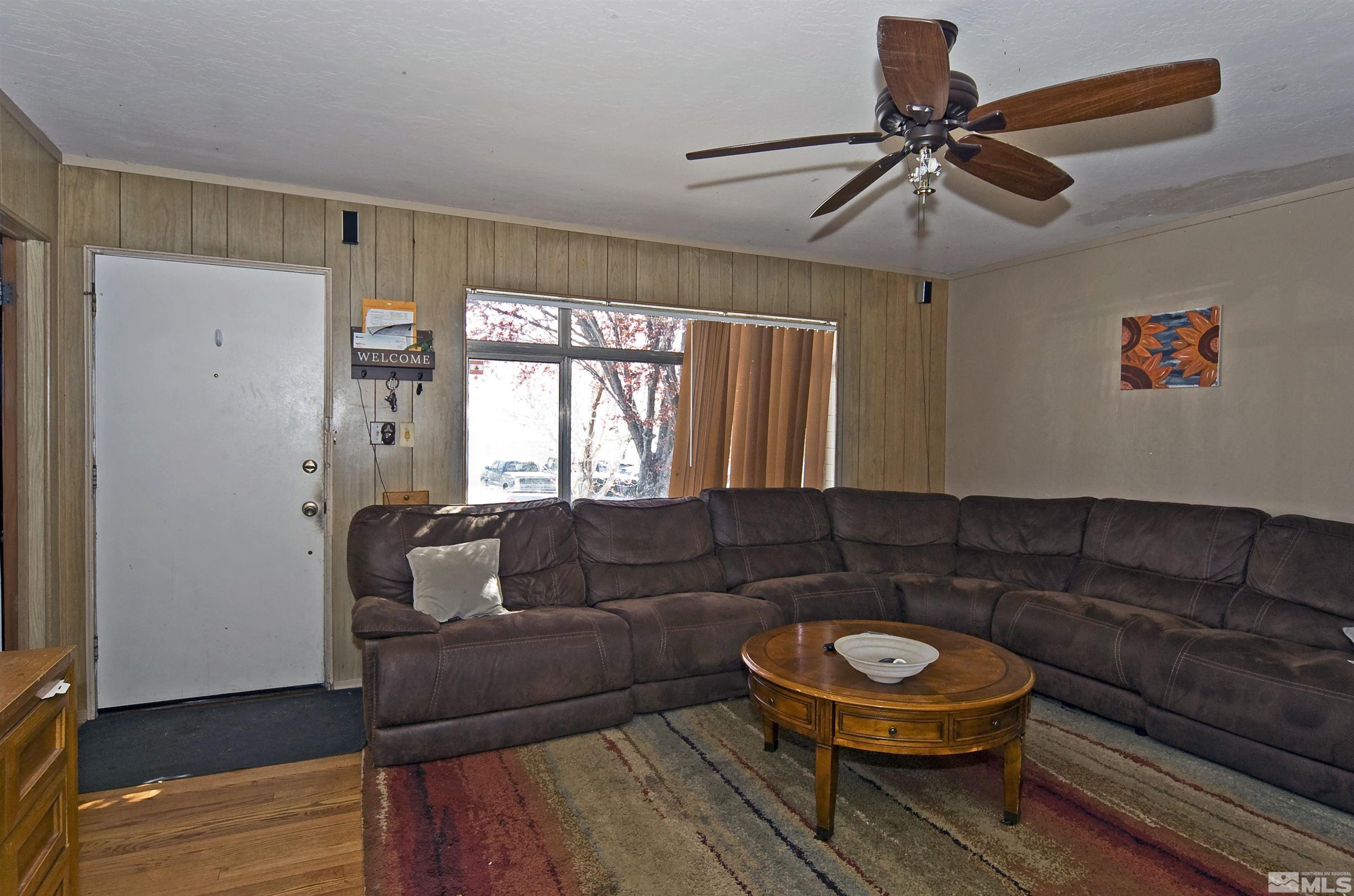 121 Bartlett Street Reno, NV 89512 - Photo 3 of 27 a living room with furniture and a window