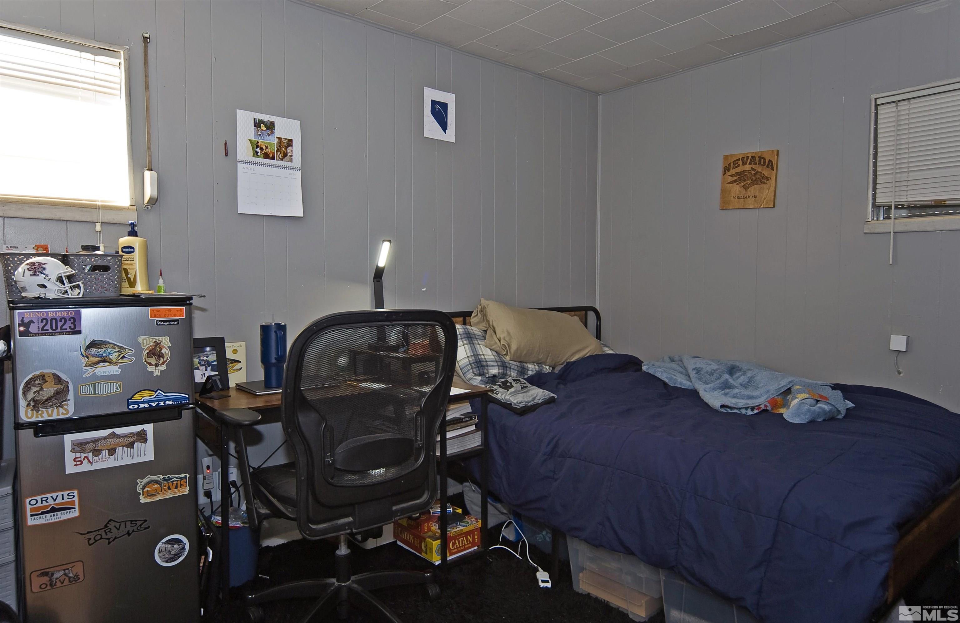 121 Bartlett Street Reno, NV 89512 - Photo 10 of 27 a bed sitting in a bedroom next to a window