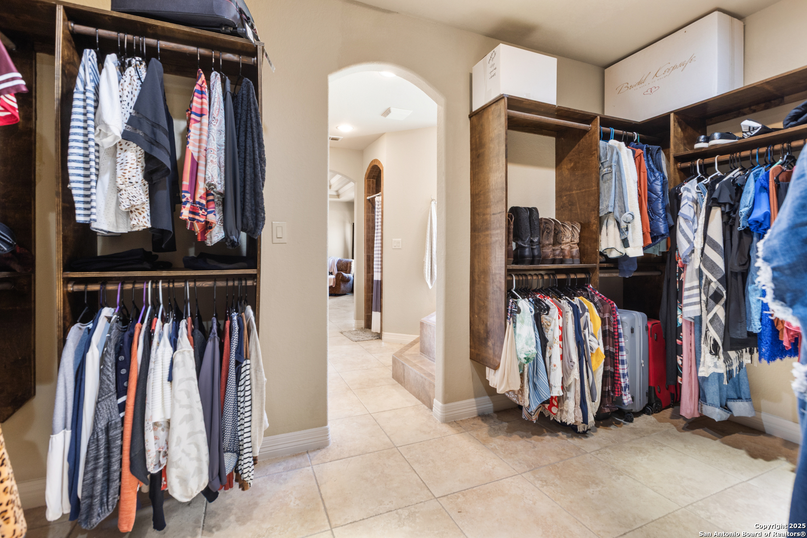 338 Tower Road San Antonio, TX 78223 - Photo 16 of 26 a view of walk in closet with clothes and shoes