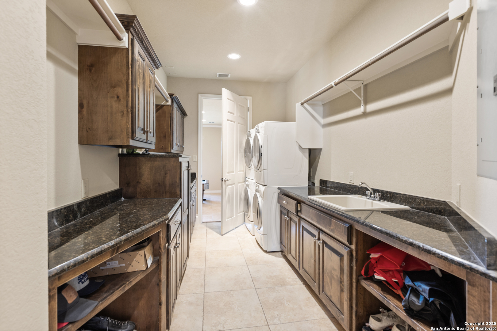 338 Tower Road San Antonio, TX 78223 - Photo 18 of 26 a kitchen with stainless steel appliances granite countertop a stove and a sink