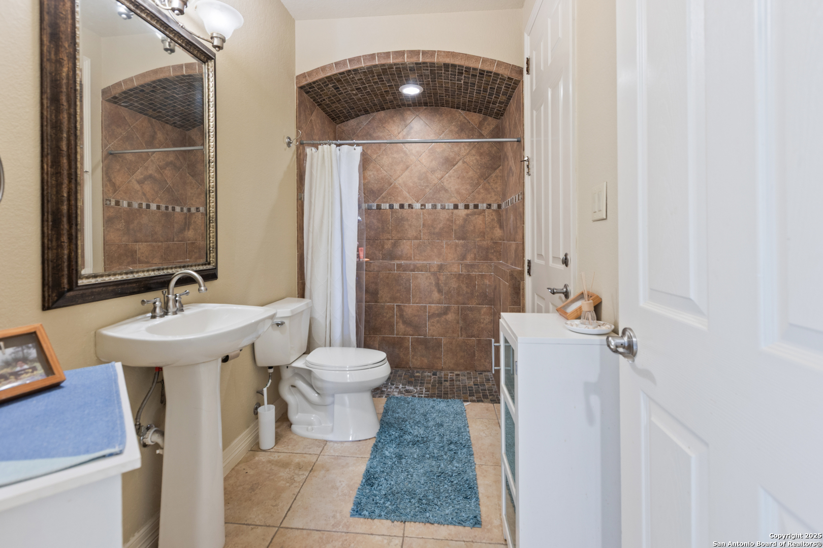 338 Tower Road San Antonio, TX 78223 - Photo 22 of 26 a bathroom with a sink toilet and shower