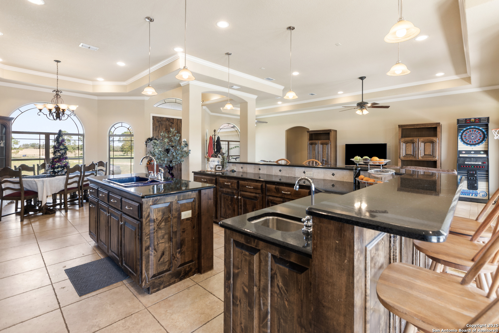 338 Tower Road San Antonio, TX 78223 - Photo 4 of 26 a kitchen with stainless steel appliances granite countertop a stove a sink a oven a dining table and chairs