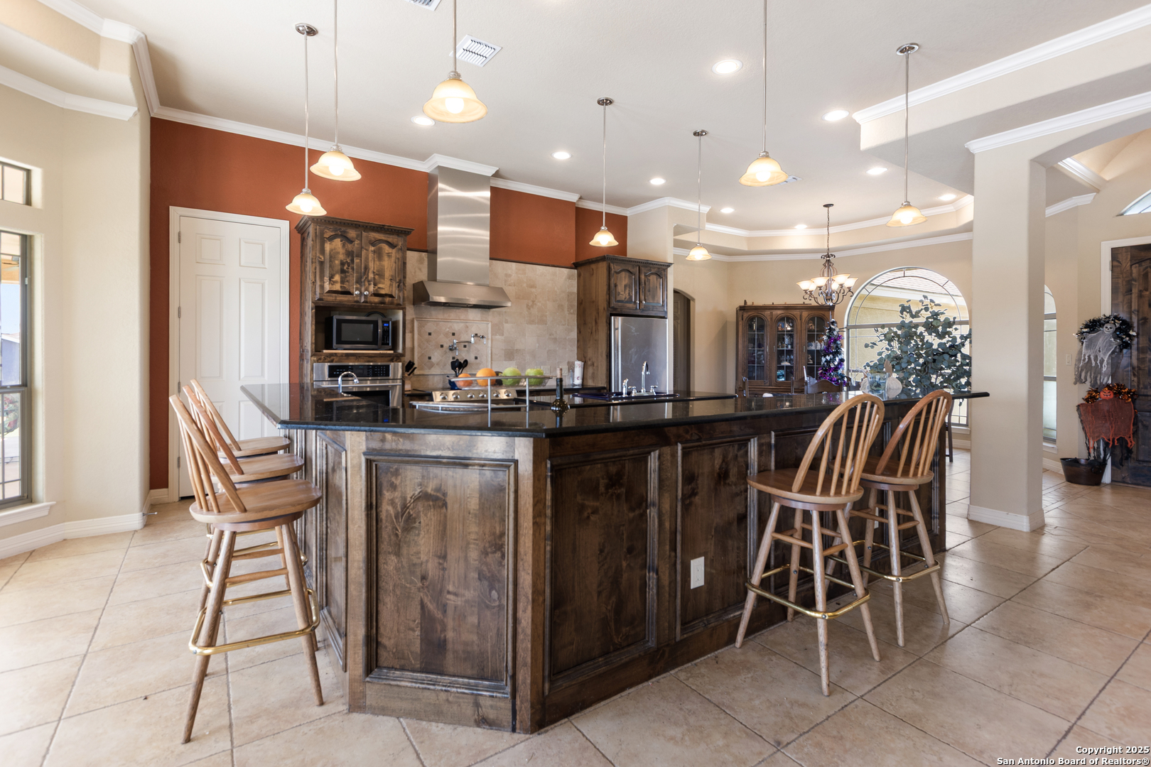 338 Tower Road San Antonio, TX 78223 - Photo 6 of 26 a kitchen with stainless steel appliances kitchen island granite countertop a table and chairs in it