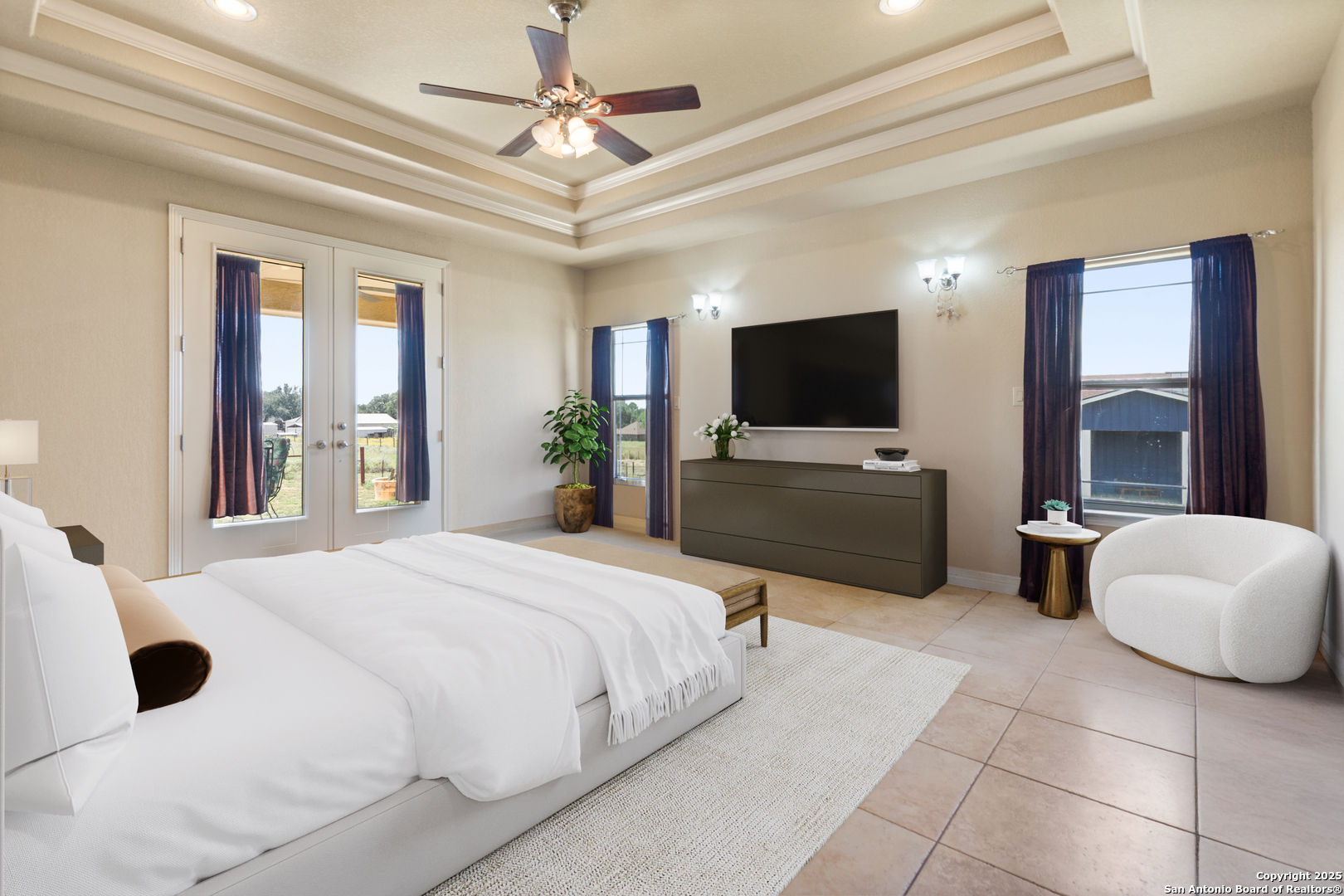 338 Tower Road San Antonio, TX 78223 - Photo 10 of 26 a bedroom with a bed a flat screen tv and couches