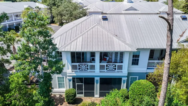 an aerial view of house with yard and outdoor seating