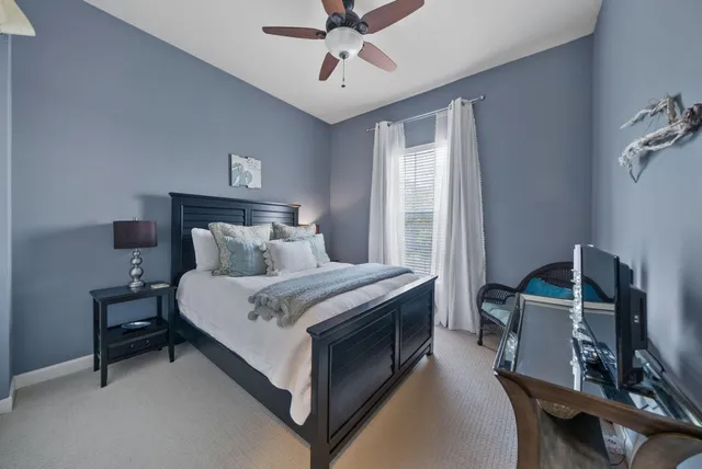 a bed room with a bed and a window