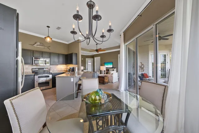 a living room with lots of furniture and kitchen view