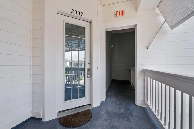 a view of a hallway with windows