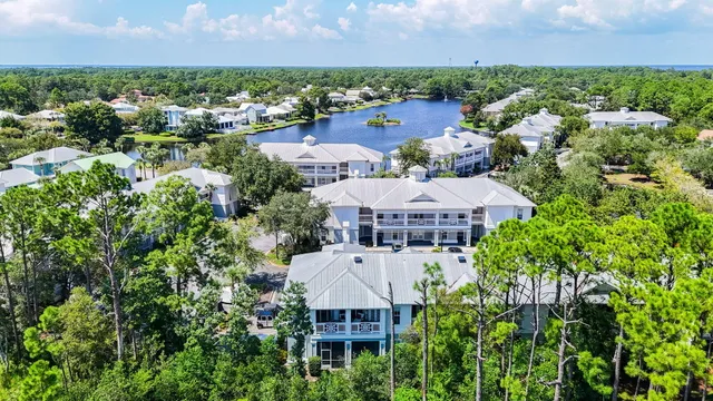 an aerial view of a house with a lake view and lake view