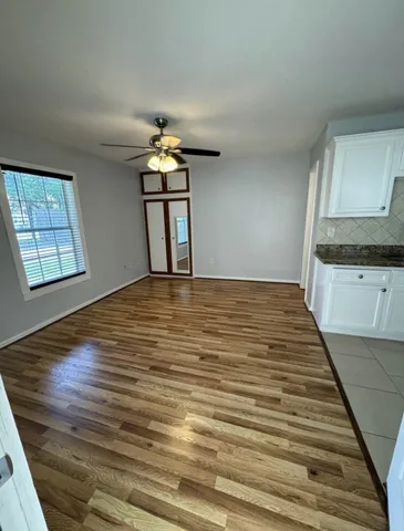 a view of an empty room and window