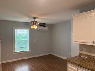 8416 La Porte Road Houston, TX 77012 - Photo 5 of 14 a view of an empty room with wooden floor and a window
