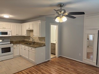 8416 La Porte Road Houston, TX 77012 - Photo 7 of 14 a kitchen with stainless steel appliances granite countertop a stove a sink and a refrigerator