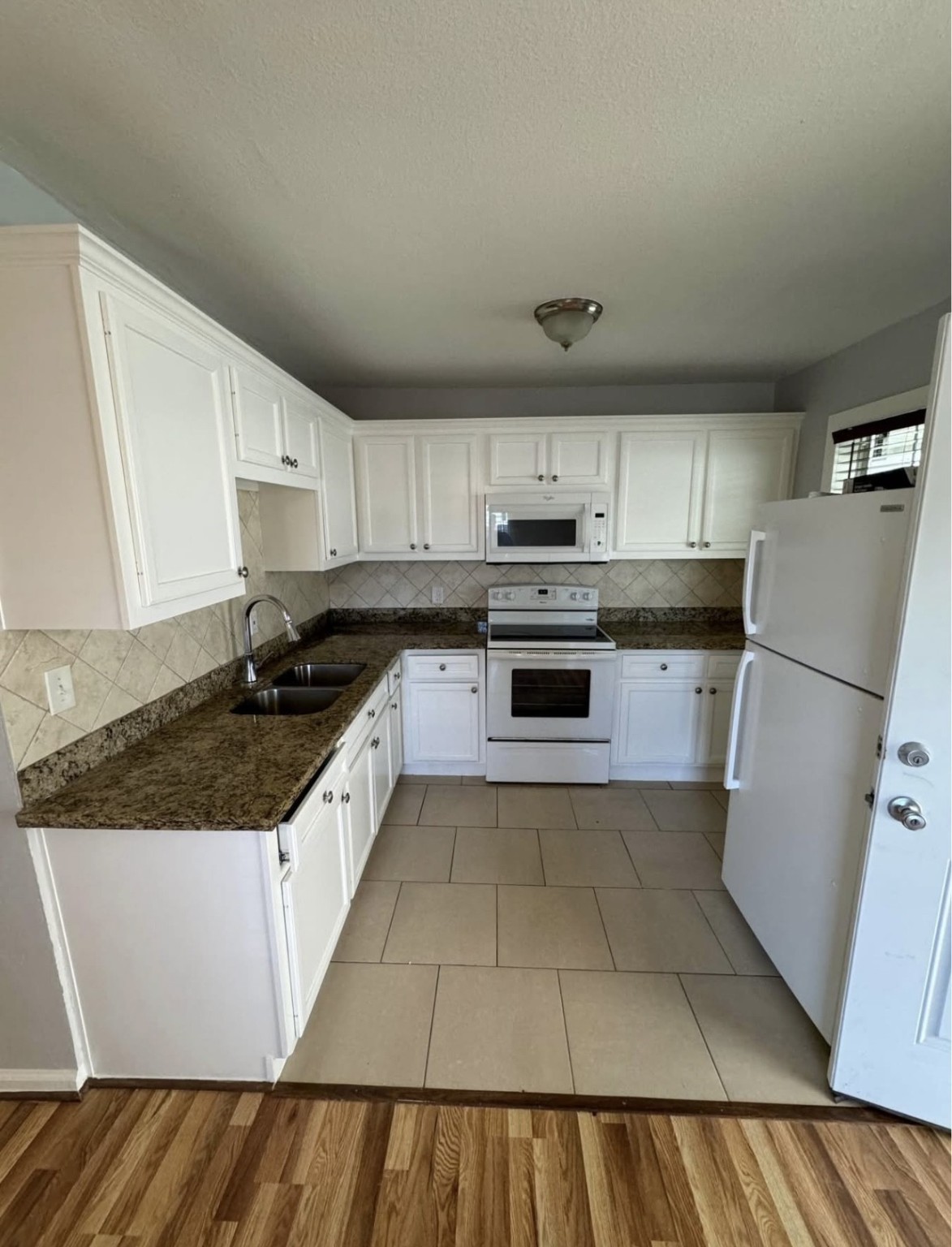 8416 La Porte Road Houston, TX 77012 - Photo 10 of 14 a large kitchen with a stove a sink and a refrigerator