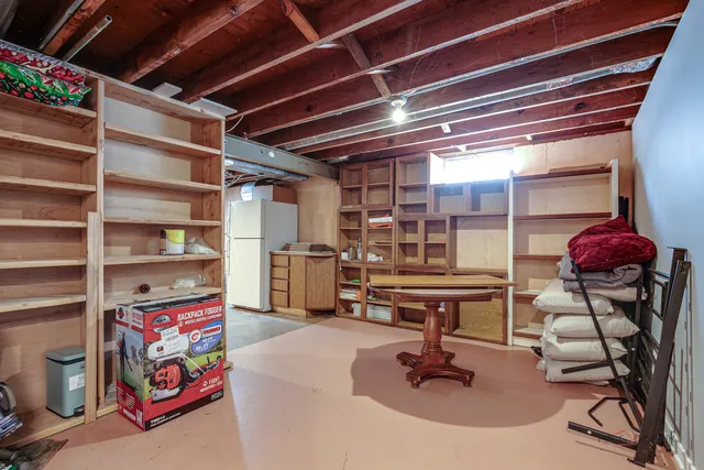 a room with lots of furniture and air hockey table