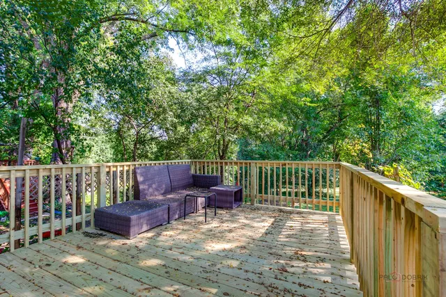 a balcony with wooden floor