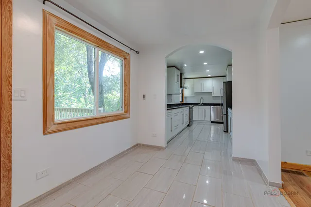 a view of a kitchen with a sink and a window