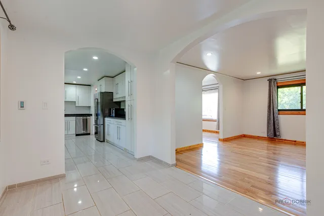a view of kitchen with cabinets and wooden floor