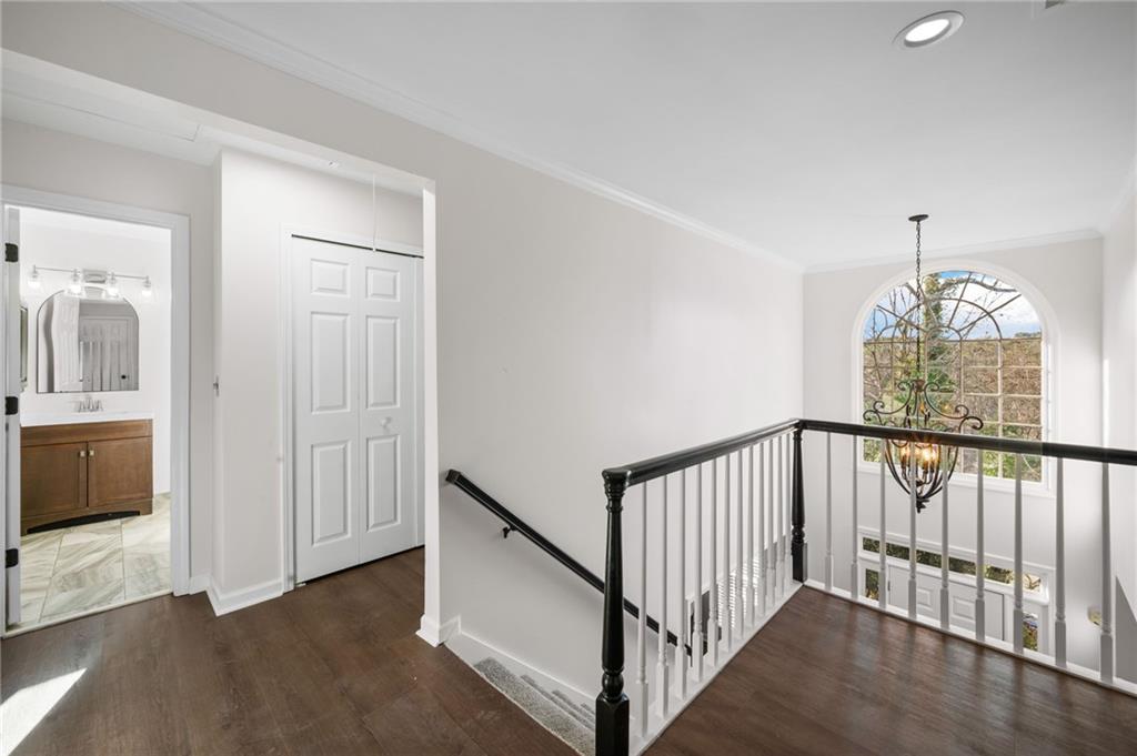 2250 Chickering Court Cumming, GA 30041 - Photo 12 of 25 a view of hallway with stairs and wooden floor