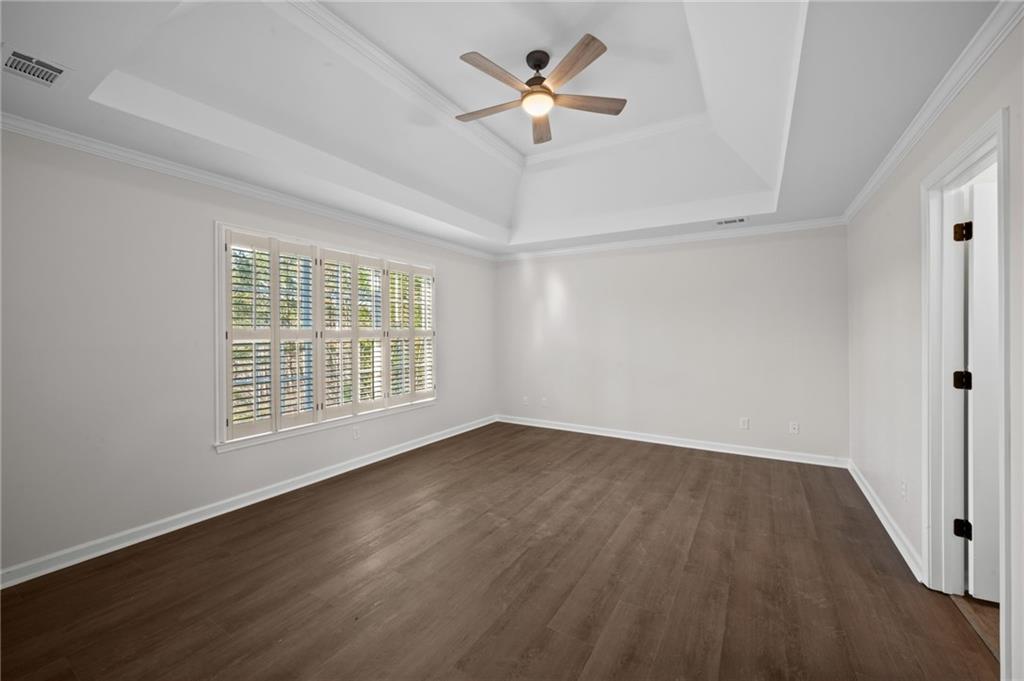 2250 Chickering Court Cumming, GA 30041 - Photo 13 of 25 wooden floor in an empty room with a window