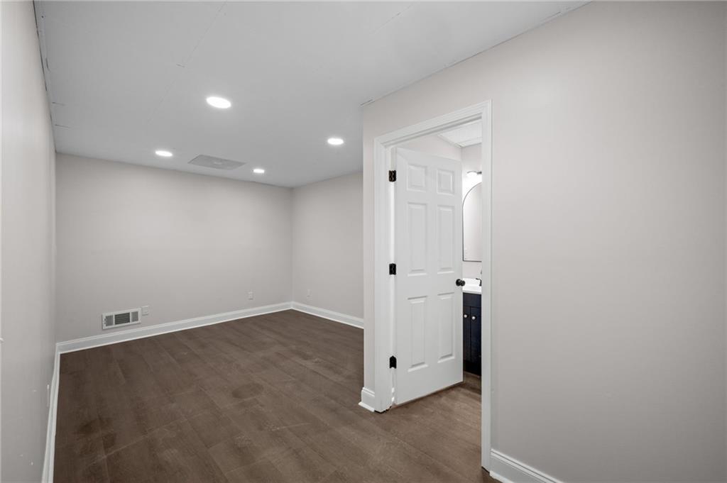 2250 Chickering Court Cumming, GA 30041 - Photo 20 of 25 an empty room with a gallery