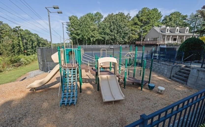 2250 Chickering Court Cumming, GA 30041 - Photo 24 of 25 a view of a slide and floor to ceiling window