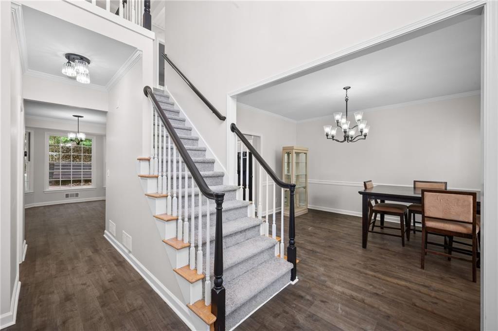 2250 Chickering Court Cumming, GA 30041 - Photo 3 of 25 a view of entryway and hall with wooden floor