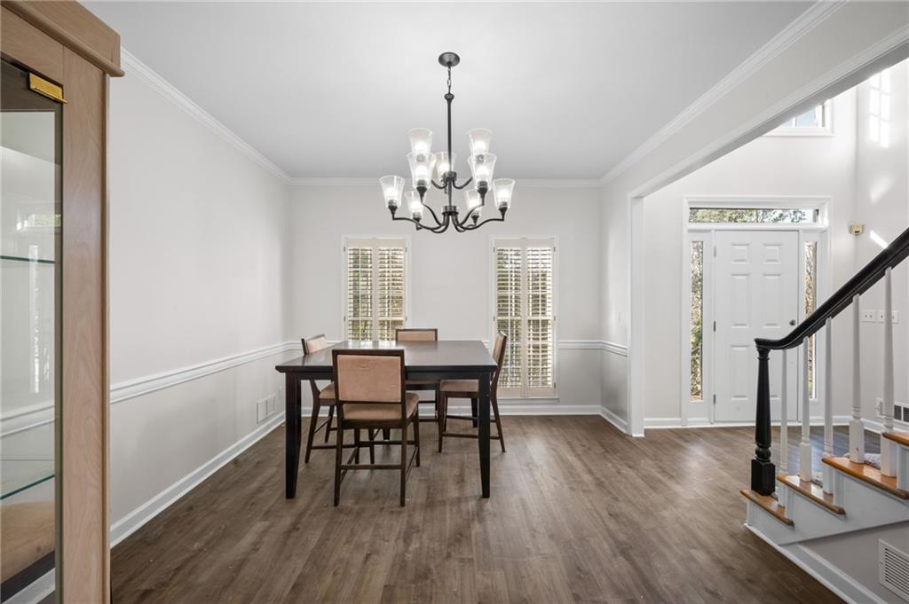 2250 Chickering Court Cumming, GA 30041 - Photo 4 of 25 a view of a dining room with furniture window and wooden floor