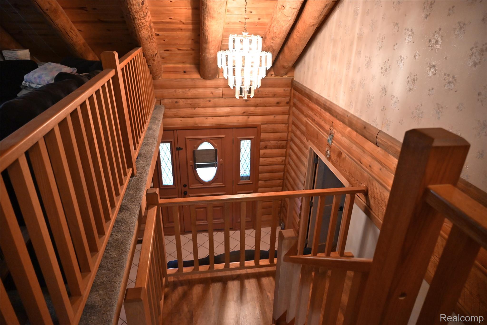 16501 Hannan Road Romulus, MI 48174 - Photo 4 of 20 Wood-paneled interior featuring a multi-level staircase with carpeted treads