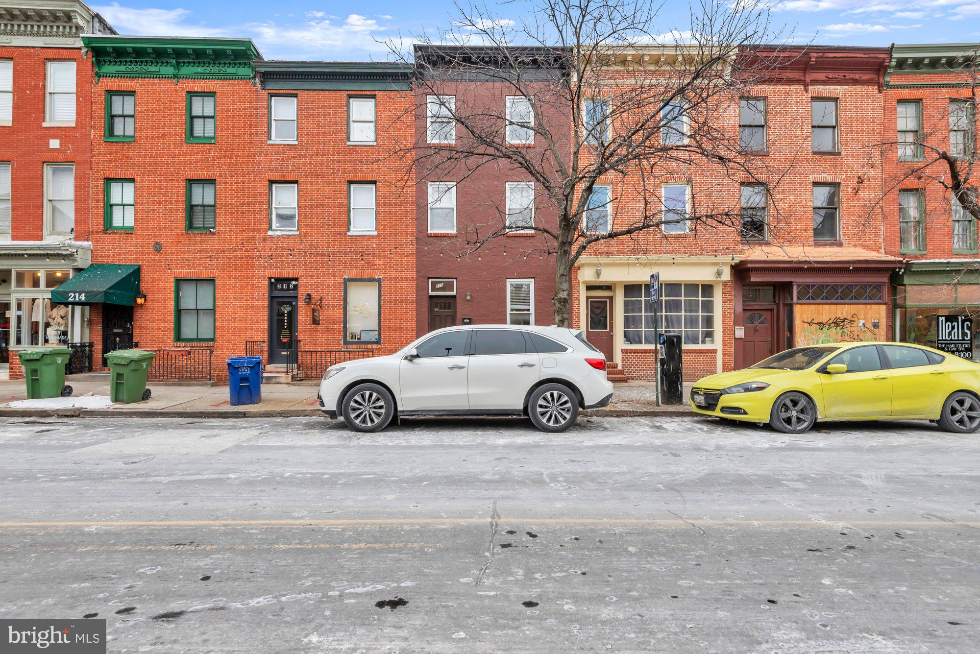 210 West Read Street Baltimore, MD 21201 - Photo 1 of 11 a view of a double door is parked in front of a building