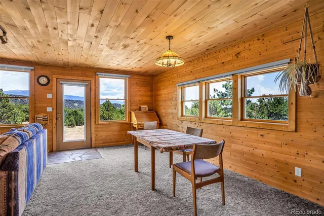 a kitchen with stainless steel appliances kitchen island granite countertop a stove and cabinets