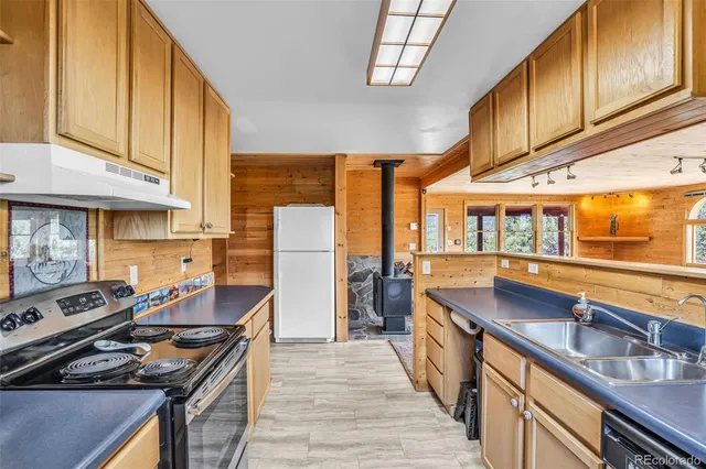 a view of a livingroom with wooden floor and a window
