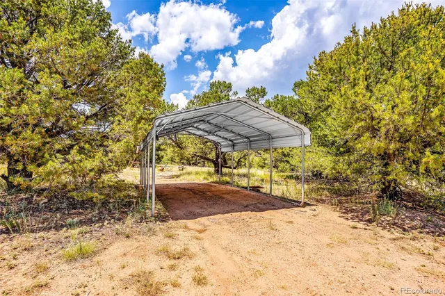 a view of a backyard with sitting area