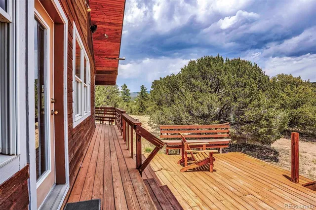 a dining hall with stainless steel appliances granite countertop a sink and cabinets