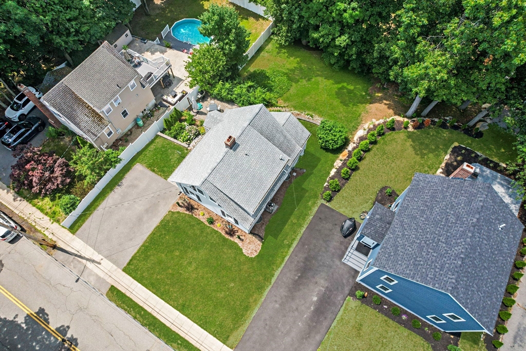 46 MacArthur Road Stoneham, MA 02180 - Photo 23 of 41 an aerial view of a house with a garden and swimming pool