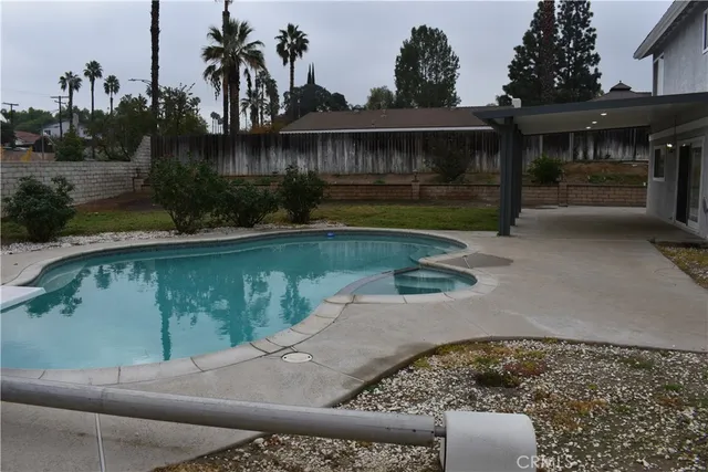 a view of a house with swimming pool