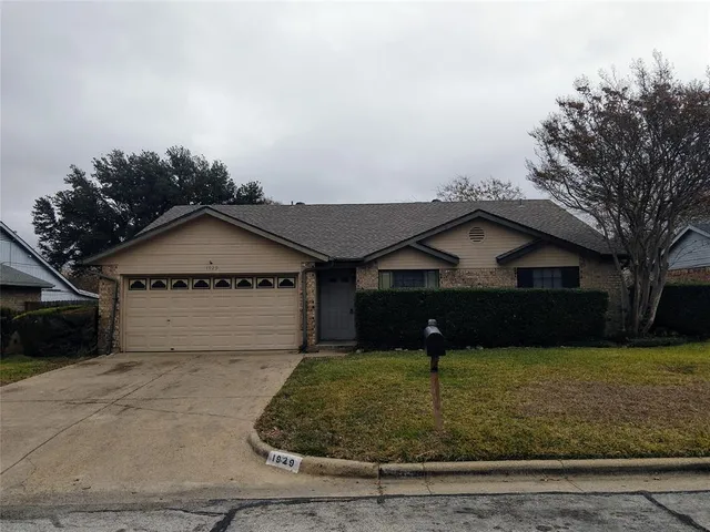 a front view of a house with yard