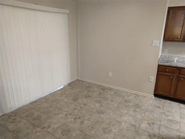 a view of a kitchen with a sink and a stove