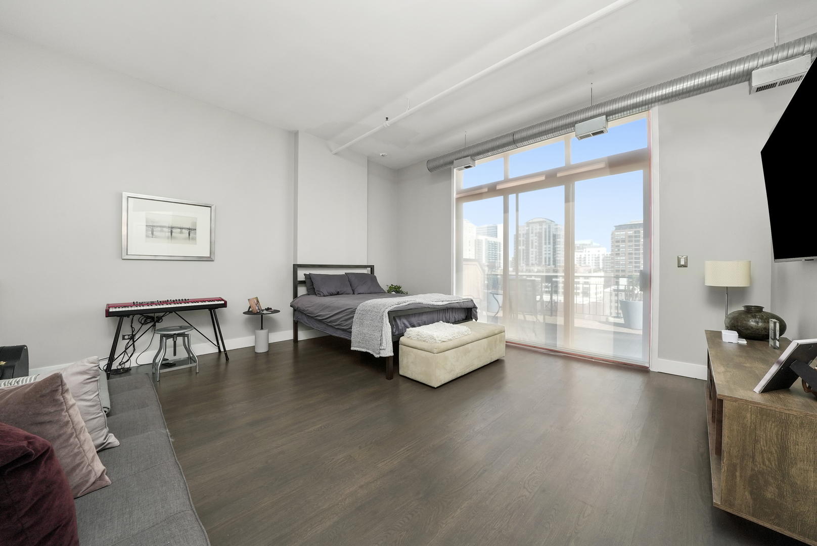 360 West Illinois Street, Unit 614 Chicago, IL 60654 - Photo 13 of 36 a living room with furniture and a flat screen tv