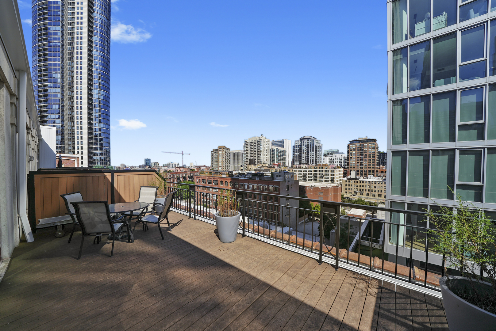 360 West Illinois Street, Unit 614 Chicago, IL 60654 - Photo 24 of 36 a view of a balcony with two chairs and a table