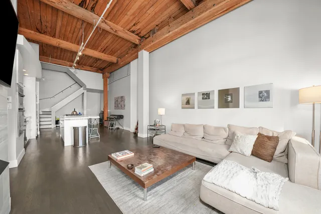 a living room with furniture and a table