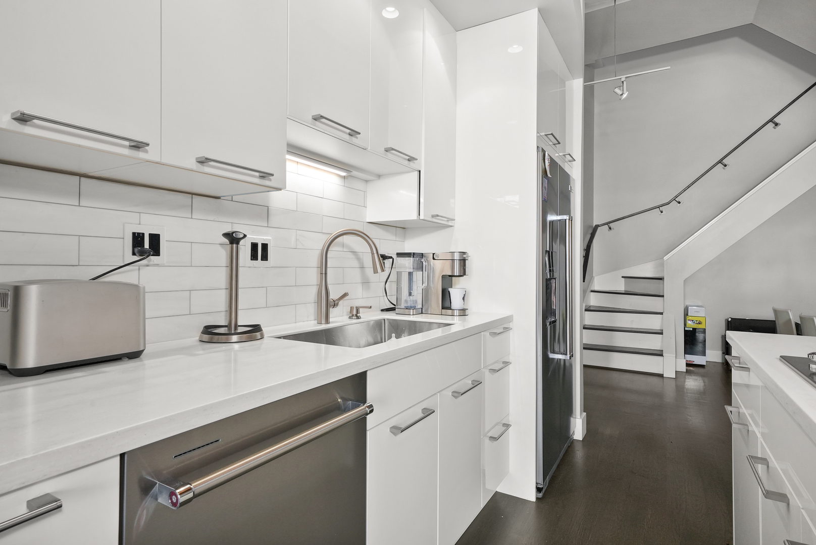 360 West Illinois Street, Unit 614 Chicago, IL 60654 - Photo 10 of 36 a kitchen with white cabinets and appliances