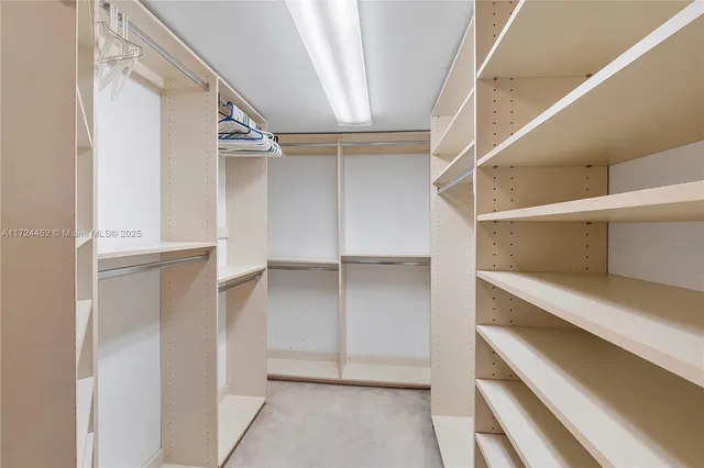 a view of an empty walk in closet
