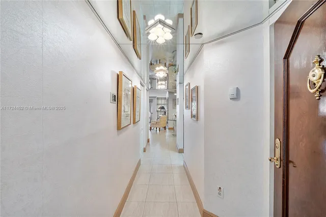 a view of a hallway with a chandelier