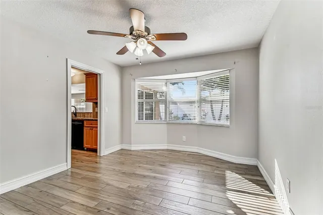 a kitchen with granite countertop a stove and a microwave
