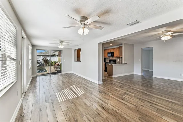 a bathroom with a granite countertop sink and a shower curtain